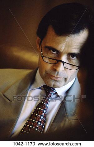 eyeglasses, business, confrontation, Middle-aged, executives, serious View Large Photo Image Stock Image - eyeglasses, business, confrontation, Middle-aged, executives, serious. Fotosearch