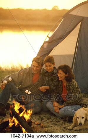 Stock Image - fire, people, dog, roast, pet, outdoors, camping. Fotosearch