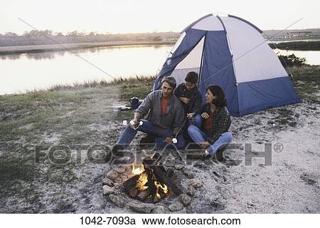 fire, relaxed, people, water, time, sitting, sunset View Large Photo Image Stock Image - fire, relaxed, people, water, time, sitting, sunset. Fotosearch