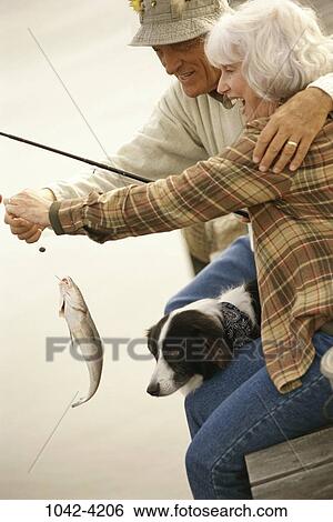 fish, people, dog, couple, sitting, senior, pet View Large Photo Image Stock Photograph - fish, people, dog, couple, sitting, senior, pet. Fotosearch