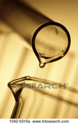 Stock Image - glass, industry, pouring, research, equipment, medicine, accuracy. Fotosearch