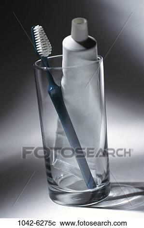 Stock Image - glass, still life, tube, toothbrush, toothpaste, hygiene. Fotosearch