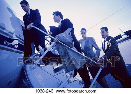 Stock Image - group, airplane, stairs, business, outdoors, transportation, entering. Fotosearch