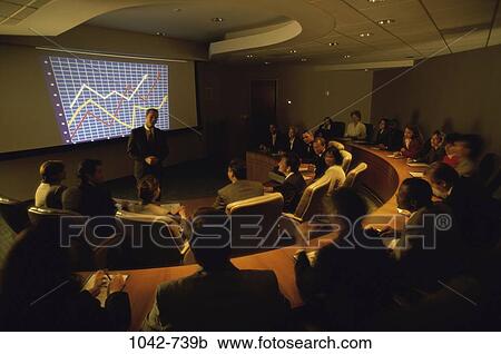 Stock Image - group, multiethnic, blur, graph, sitting, chart. Fotosearch