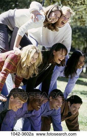 group, multiethnic, people, laughing, playful, outdoors, teamwork View Large Photo Image Stock Image - group, multiethnic, people, laughing, playful, outdoors, teamwork. Fotosearch