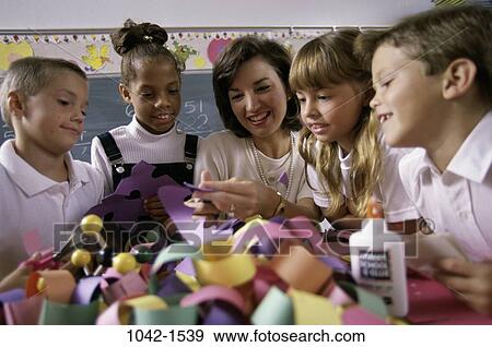 group, multiethnic, people, paper, teacher, school, classroom View Large Photo Image Stock Photo - group, multiethnic, people, paper, teacher, school, classroom. Fotosearch