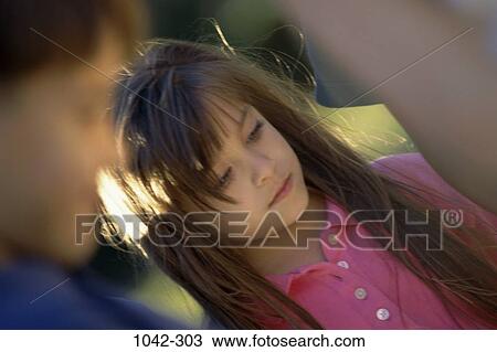 Stock Image - group, people, pensive, Hispanic, girl, outdoors, contemplation. Fotosearch