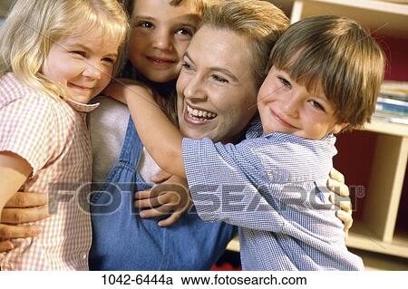 group, people, smiling, teacher, school, hugging, joyous View Large Photo Image Stock Image - group, people, smiling, teacher, school, hugging, joyous. Fotosearch