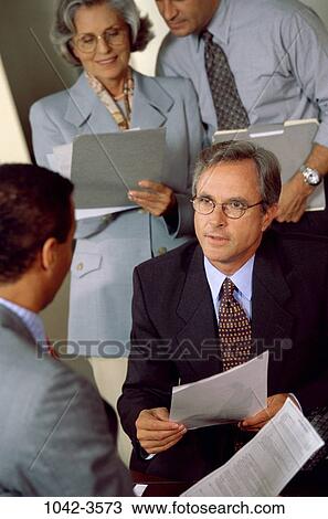 Stock Image - groups, discussion, choices, business, challenges, Middle-aged, executives. Fotosearch