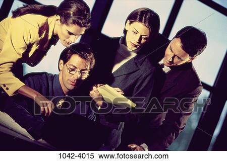 Stock Photography - groups, Hispanic, notepad, leaning, business, Middle-aged, teamwork. Fotosearch