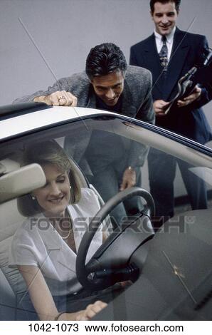 Stock Image - groups, people, smiling, suit, car, pearl, dress. Fotosearch