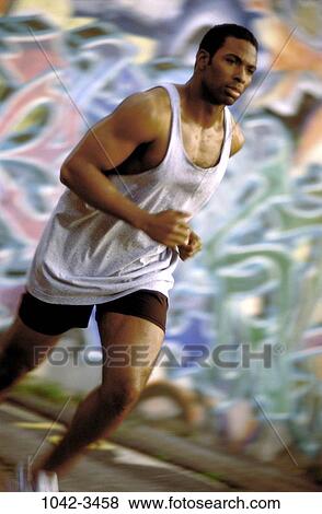 Stock Photo - jogging, health, strength, exercise, commitment, graffiti. Fotosearch