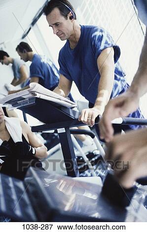 Stock Photo - listening, health, sports, exercise, exercising, indoors. Fotosearch