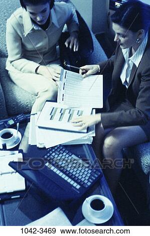 meeting, coffee, Hispanic, computer, laptop, chart, business View Large Photo Image Stock Photo - meeting, coffee, Hispanic, computer, laptop, chart, business. Fotosearch