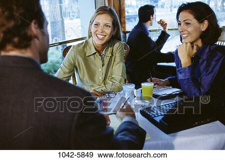 meeting, group, women, smiling, table, laptop View Large Photo Image Stock Photo - meeting, group, women, smiling, table, laptop. Fotosearch