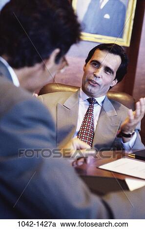 meeting, men, desk, consultation, talking, consulting, business View Large Photo Image Stock Image - meeting, men, desk, consultation, talking, consulting, business. Fotosearch