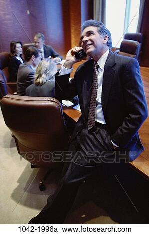 meeting, telephone, phone, business, Middle-aged, executives, indoors View Large Photo Image Stock Image - meeting, telephone, phone, business, Middle-aged, executives, indoors. Fotosearch