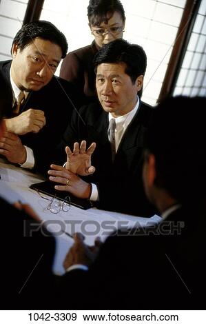 meetings, business, global, executives, Middle-aged, serious, Asian View Large Photo Image Stock Photo - meetings, business, global, executives, Middle-aged, serious, Asian. Fotosearch