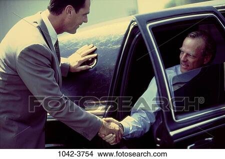 Picture - men, car, business, outdoors, transportation, businessmen. Fotosearch