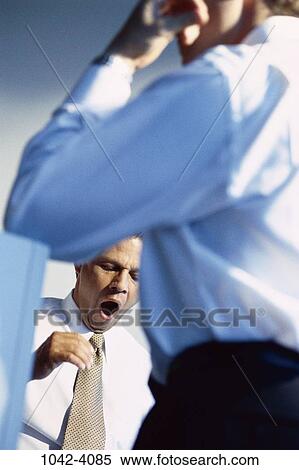 Stock Photography - men, morning, business, Middle-aged, tired, businessmen, yawning. Fotosearch