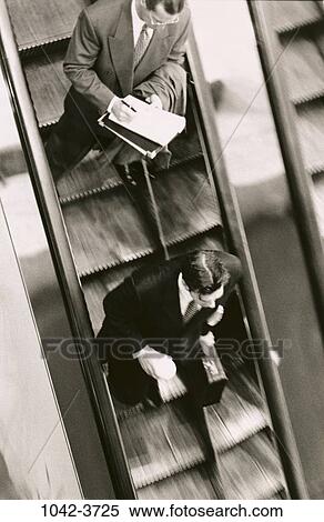 men, people, escalator, newspaper, briefcase, motion, business View Large Photo Image Stock Photography - men, people, escalator, newspaper, briefcase, motion, business. Fotosearch
