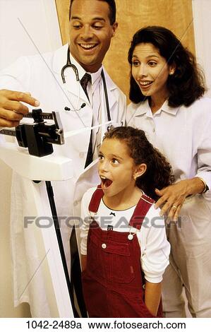 Stock Image - mother, Hispanic, doctor, health, family, child, surprise. Fotosearch