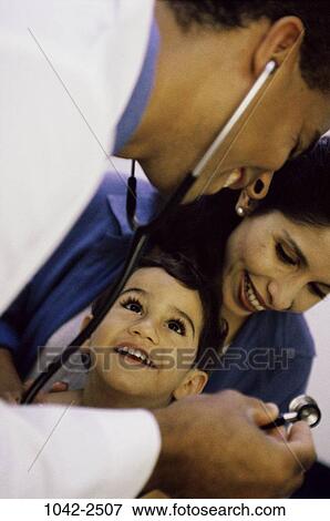 Stock Photo - mother, Hispanic, doctor, stethoscope, health, child, medical. Fotosearch