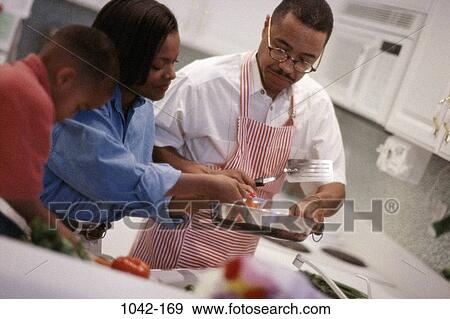 mother, people, listening, eyeglasses, talking, cooking, attentive View Large Photo Image Stock Photo - mother, people, listening, eyeglasses, talking, cooking, attentive. Fotosearch