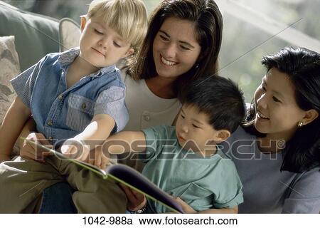 multiethnic, groups, people, window, mother, reading, couch View Large Photo Image Stock Image - multiethnic, groups, people, window, mother, reading, couch. Fotosearch
