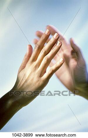 Stock Photo - multiethnic, hands, achievement, unity, romance, love, tenderness. Fotosearch