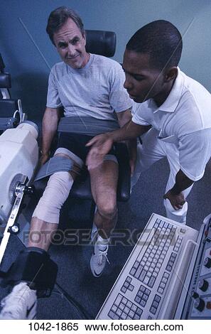 Stock Photography - multiethnic, men, industry, patient, injury, health, exercise. Fotosearch