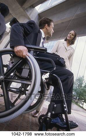 multiethnic, people, building, briefcase, talking, conversation, wheelchair View Large Photo Image Stock Photo - multiethnic, people, building, briefcase, talking, conversation, wheelchair. Fotosearch