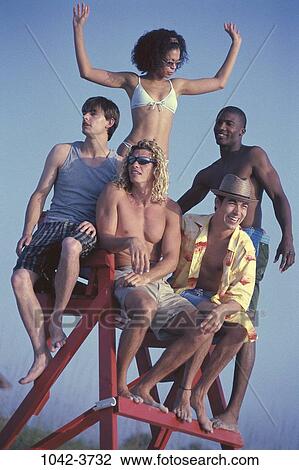 multiethnic, people, chair, beach, sunglasses, looking, watching View Large Photo Image Stock Image - multiethnic, people, chair, beach, sunglasses, looking, watching. Fotosearch