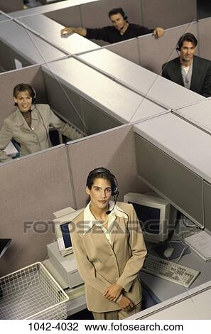 Stock Image - multiethnic, people, desk, headset, business, administrative, cubicles. Fotosearch