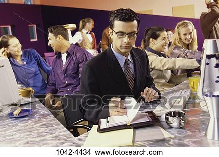 multiethnic, people, planner, technology, computer, cafe View Large Photo Image Picture - multiethnic, people, planner, technology, computer, cafe. Fotosearch