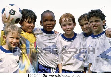 Stock Image - multiethnic, people, playing, ball, standing, outdoors, sports. Fotosearch
