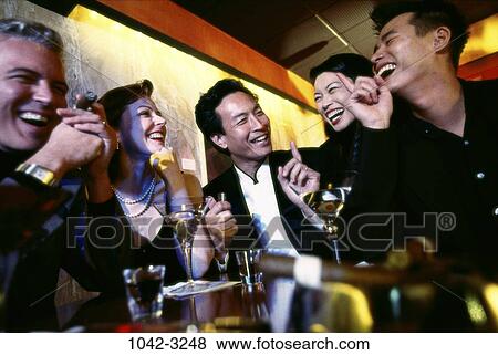 multiethnic, people, smiling, cigar, talking, Asian View Large Photo Image Stock Photo - multiethnic, people, smiling, cigar, talking, Asian. Fotosearch