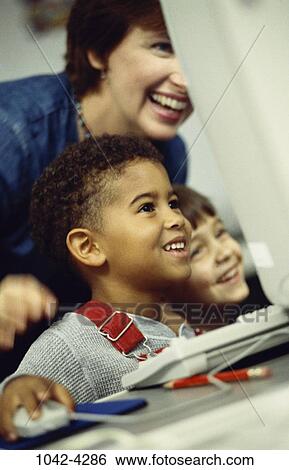 multiethnic, people, smiling, teacher, school, computer, enthusiastic View Large Photo Image Stock Photograph - multiethnic, people, smiling, teacher, school, computer, enthusiastic. Fotosearch