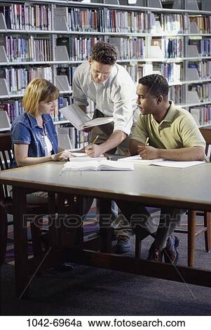 multiethnic, people, table, books, studying, library, research View Large Photo Image Stock Image - multiethnic, people, table, books, studying, library, research. Fotosearch