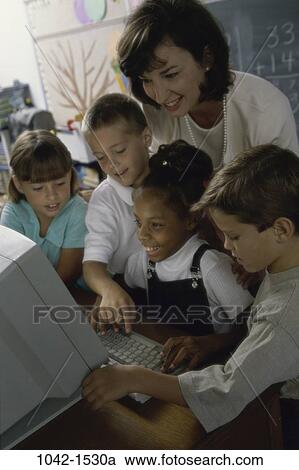 Stock Image - multiethnic, people, teacher, school, computer, classroom, children. Fotosearch