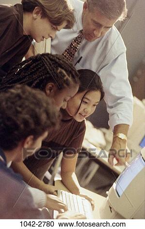 multiethnic, people, teacher, school, computer, pointing, point View Large Photo Image Stock Image - multiethnic, people, teacher, school, computer, pointing, point. Fotosearch