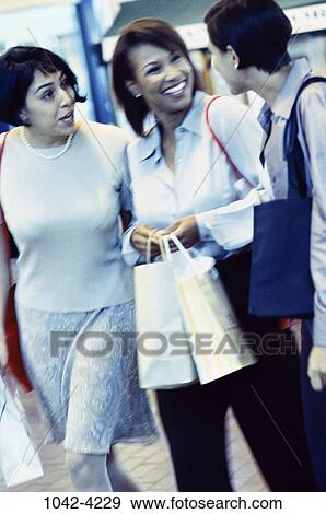 multiethnic, women, people, talking, conversation, gossiping, outdoors View Large Photo Image Stock Photo - multiethnic, women, people, talking, conversation, gossiping, outdoors. Fotosearch