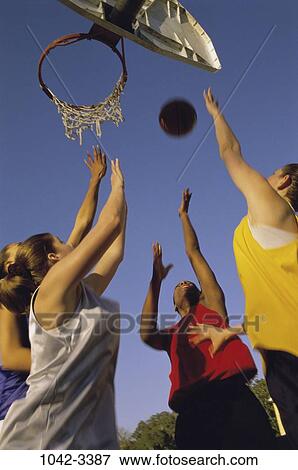 Stock Photo - multiethnic, women, playing, ball, outdoors, sports, basketball. Fotosearch