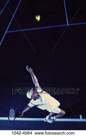 Picture - overhead, people, evening, ball, swinging, swing. Fotosearch
