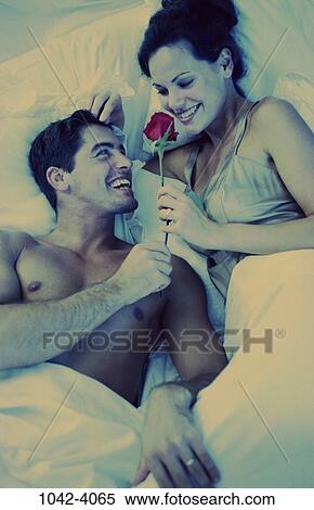 overhead, people, smiling, couple, bed, rose, flower View Large Photo Image Stock Photography - overhead, people, smiling, couple, bed, rose, flower. Fotosearch