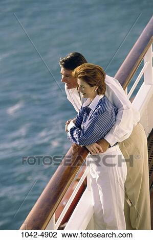 Stock Image - overhead, people, water, sea, staring, couple, ocean. Fotosearch