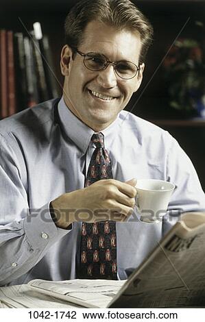 paper, desk, smiling, morning, newspaper, eyeglasses View Large Photo Image Stock Image - paper, desk, smiling, morning, newspaper, eyeglasses. Fotosearch
