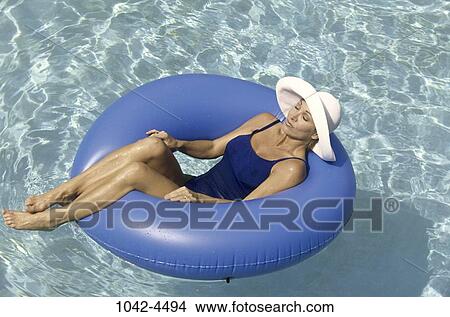 peace, relaxed, people, swim, floating, pool, woman View Large Photo Image Picture - peace, relaxed, people, swim, floating, pool, woman. Fotosearch