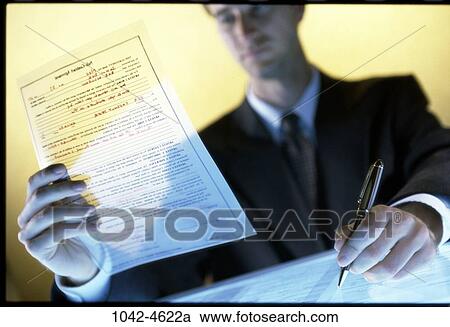 Stock Image - pen, paper, desk, reading, business. Fotosearch