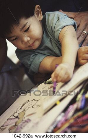people, Asian, books, coloring, concentrating, boy View Large Photo Image Stock Image - people, Asian, books, coloring, concentrating, boy. Fotosearch
